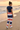 Back view of striped joggers at the shoreline