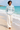 Barefoot beach look with cream linen trousers