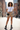 Beige plaid shorts white tee