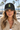 Black cap on female model