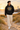 Black hoodie with cream trousers on a male model