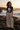 Black shirt on a volcanic shoreline