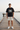 Black tee with cream shorts