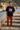 Black tee with rust chinos