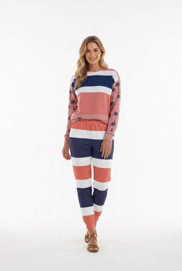 Blonde model wearing striped joggers with her original sweatshirt