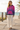 Blonde model wearing the tropical hoodie with ivory linen pants