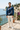 Blue quarter-zip styled on a coastal terrace