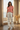 Botanical pajama pants styled with a coral knit top