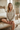 Botanical pajama top styled with cream shorts