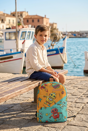 Boy in linen shirt beside marina