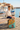 Boy in linen shirt beside marina
