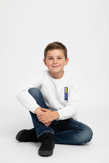 Boy sitting in white sweatshirt