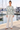Camo sweater with ivory linen trousers