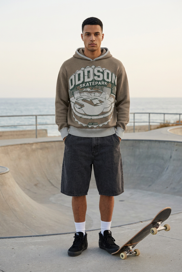Charcoal denim shorts at a skate plaza