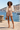 Coastal harbor with an ivory African-inspired cropped jacket