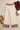 Cream bordered pants styled with a burgundy top