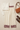 Cream bordered pants styled with an ivory long-sleeved top