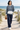 Female boardwalk look with navy tailored trousers
