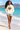 Female cream hoodie beach look with denim shorts