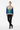 Female model - classy styling with tailored trousers and heels