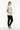 Female model in black joggers and tan sneakers