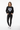Female model in black sweatshirt with black jeans