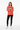 Female model in burnt orange crewneck with black leggings