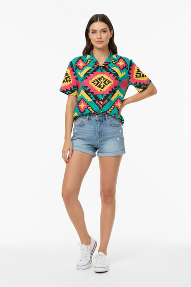 Female model in denim shorts and white sneakers