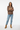 Female model in espresso brown sweatshirt with light wash denim jeans