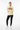Female model in ivory sweatshirt with black leggings