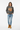 Female model in pepper gray sweatshirt with light wash denim