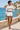 Female model in sweatshirt and white tailored shorts