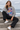 Female model in the carbon-grey Surfxion sweatshirt