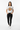 Female model in white fleck tee with black jeans