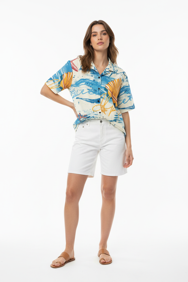 Female model in white shorts and tan sandals