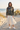 Female model in woodland camo hoodie and ivory skirt