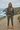 Female model in woodland camo hoodie with cargo trousers at the coast