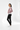 Female model side view with black jeans