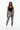 Female model standing one hand in pocket confident