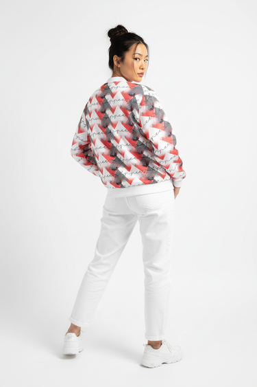 Female model three-quarter back with white pants