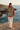 Female model wearing the hoodie with ivory linen pants