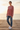 Female model wearing the sweatshirt with distressed blue jeans
