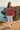 Female model wearing the sweatshirt with ivory linen pants