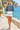 Female promenade look with ivory shorts