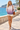 Female promenade look with ivory shorts