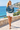 Female promenade look with ivory shorts