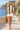 Female promenade look with ivory shorts