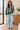 Female window-side look with light-wash jeans