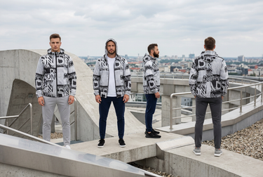 Four jacket looks in an urban rooftop editorial banner