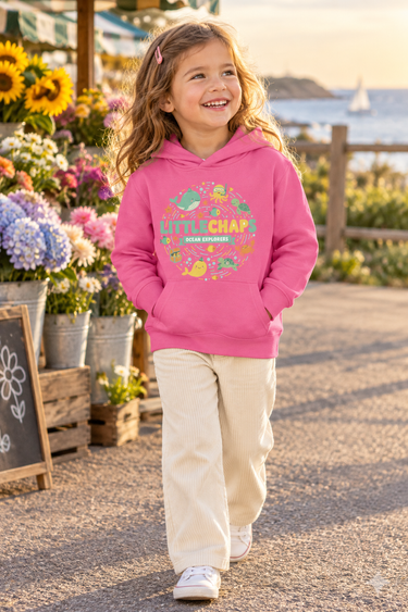 Four-year-old girl in raspberry hoodie at a coastal flower market